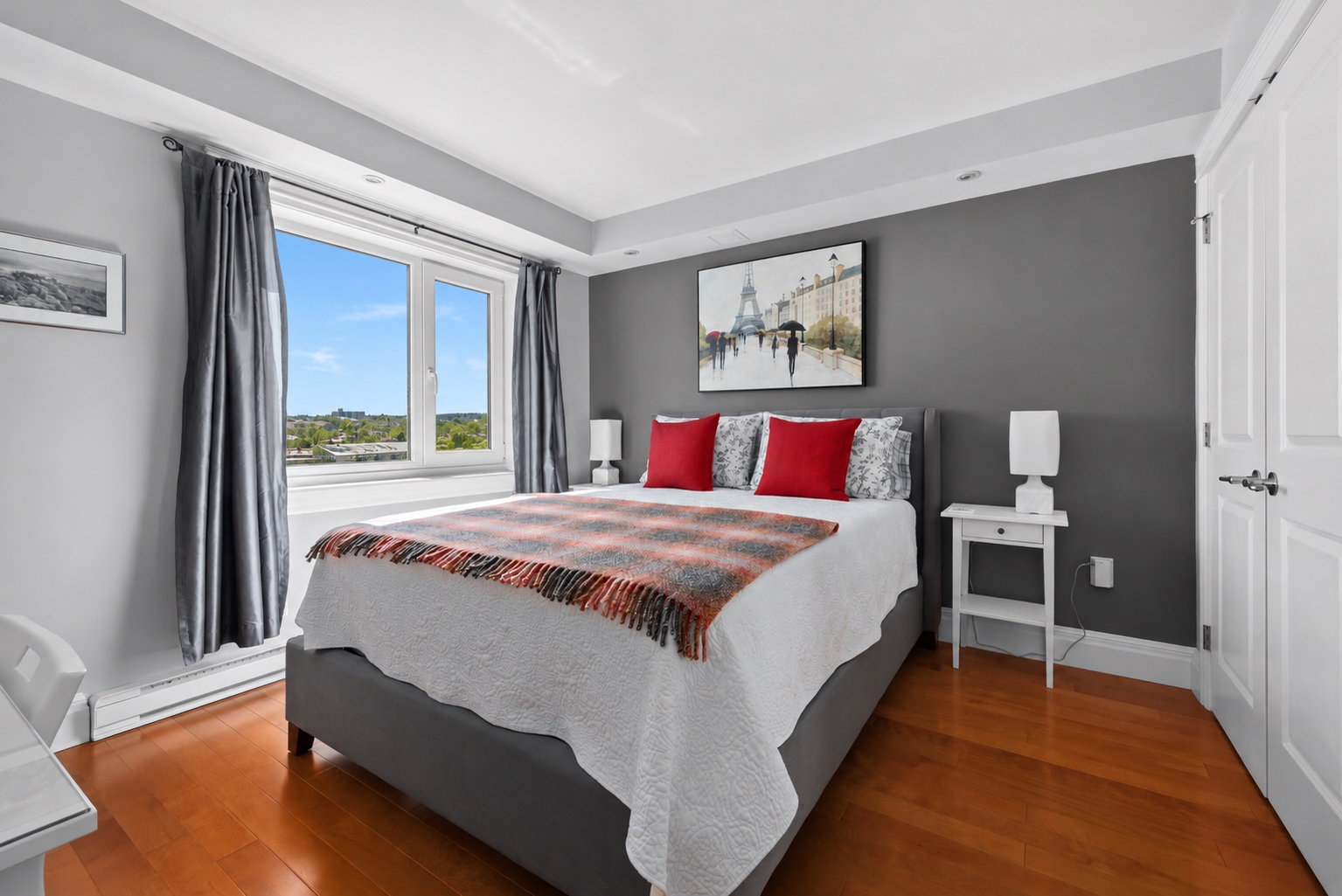 Modern bedroom with a green summer view