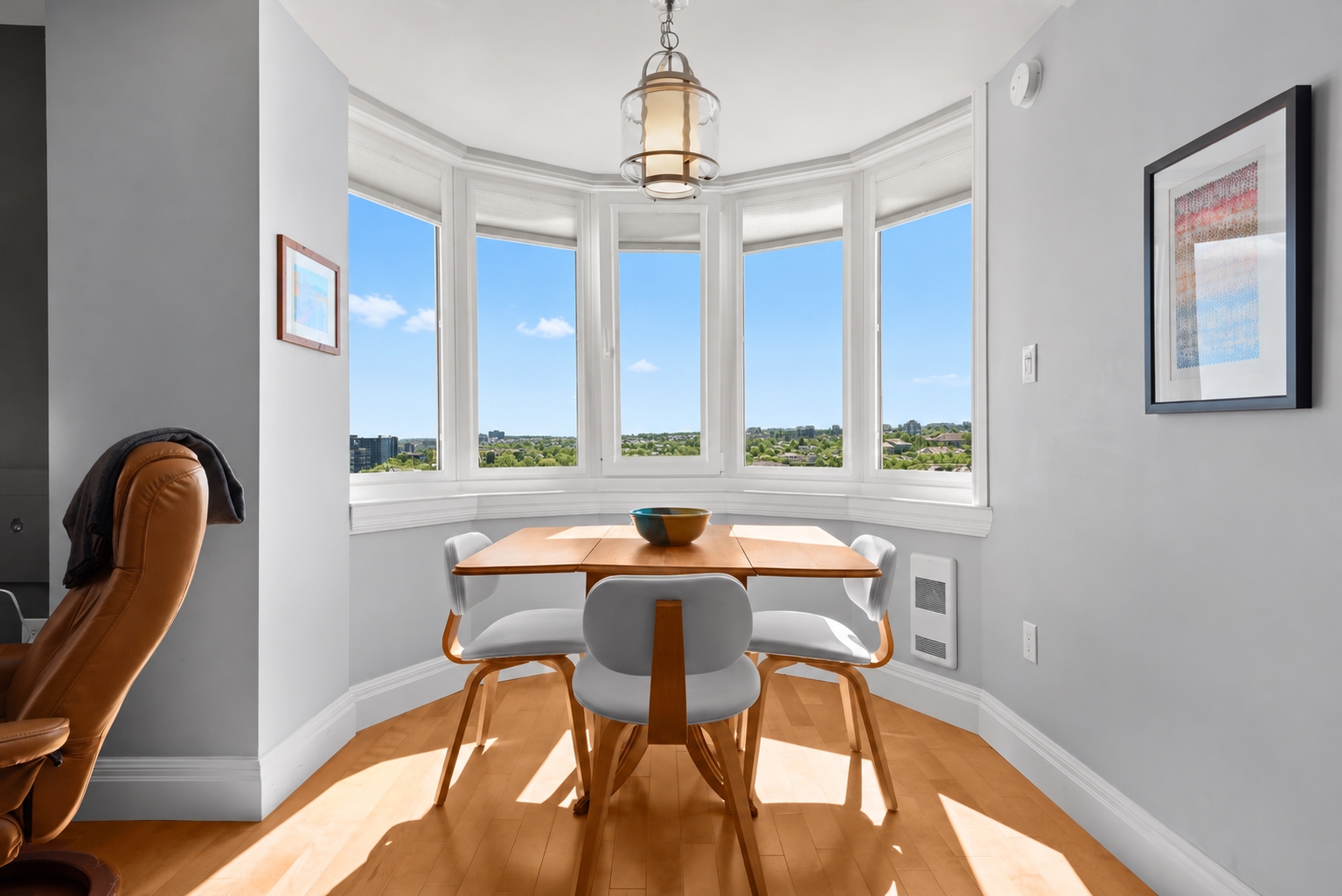 Sunlit summer bay window dining nook